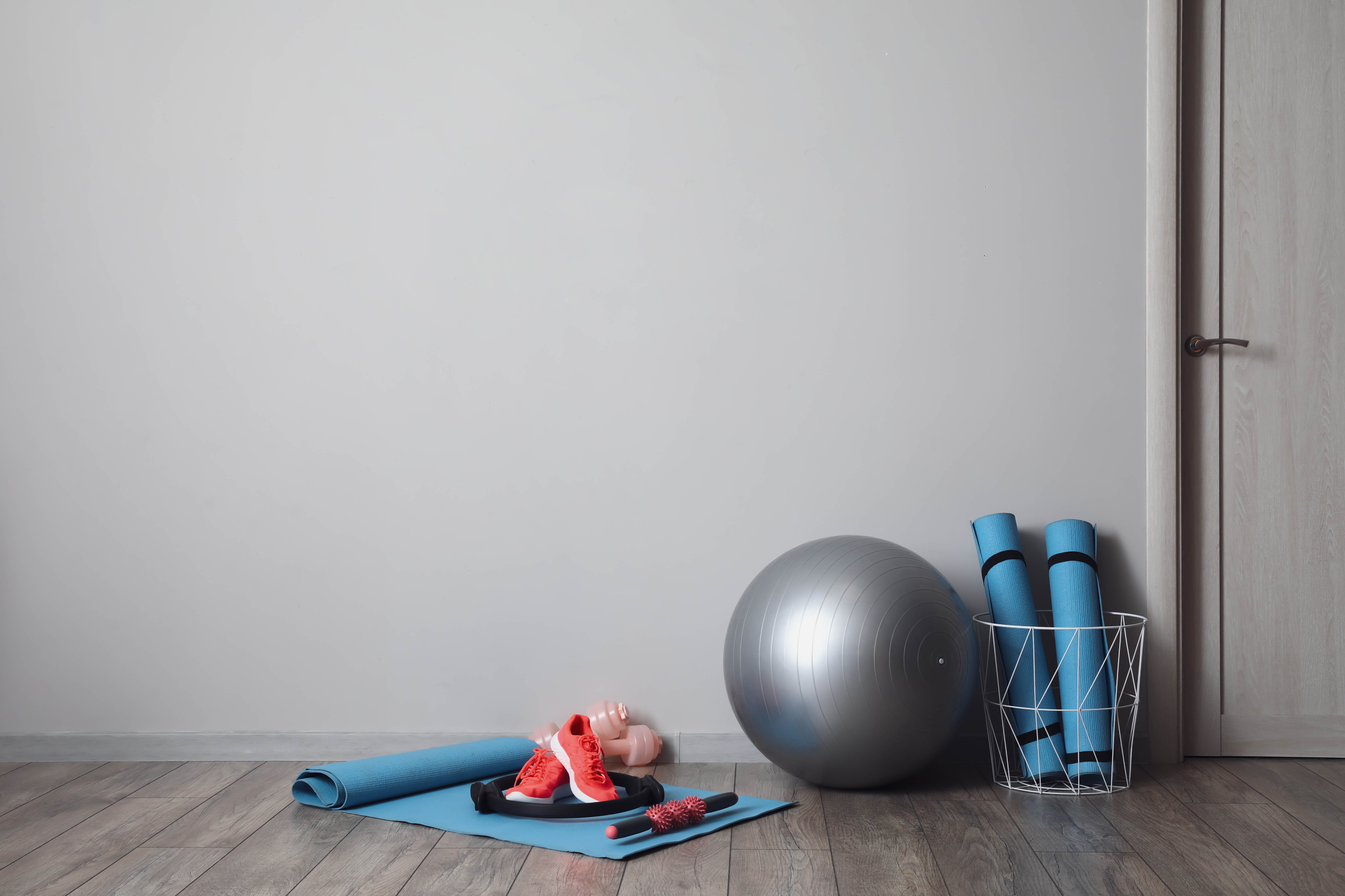 Set of Sports Equipment on Floor in Gym